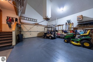 Tucked away in a private setting with frontage on the 13th hole on Schuss Mountain Golf Club in Michigan - for sale on GolfHomes.com, golf home, golf lot
