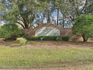 Spacious, gracious 2/2/2 + den pool home, on 14th green of on Silverthorn Country Club in Florida - for sale on GolfHomes.com, golf home, golf lot