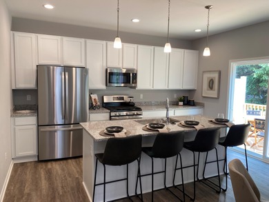 This beautiful new townhome offers modern style and on Alwyn Downs Golf Club in Michigan - for sale on GolfHomes.com, golf home, golf lot