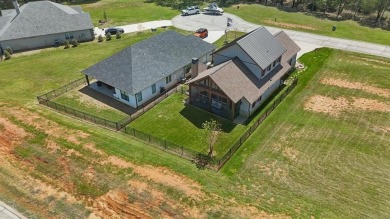 Discover the perfect retreat in Rock Creek. Nestled on the on Rock Creek Golf Club in Texas - for sale on GolfHomes.com, golf home, golf lot