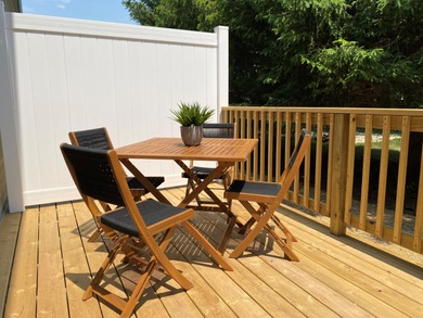 This new townhome blends modern design with everyday convenience on Alwyn Downs Golf Club in Michigan - for sale on GolfHomes.com, golf home, golf lot