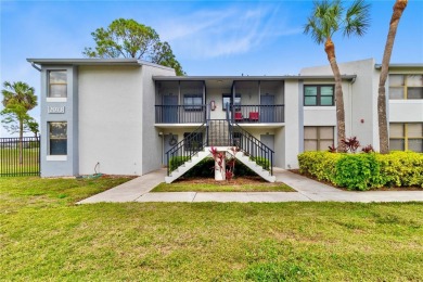 GROUND FLOOR, CORNER UNIT WITH UNOBSTRUCTED GOLF COURSE VIEWS on Feather Sound Country Club in Florida - for sale on GolfHomes.com, golf home, golf lot