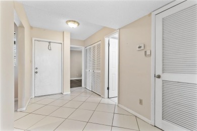 GROUND FLOOR, CORNER UNIT WITH UNOBSTRUCTED GOLF COURSE VIEWS on Feather Sound Country Club in Florida - for sale on GolfHomes.com, golf home, golf lot