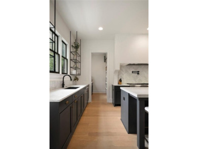Stunning newer construction with modern flair, ideally located on Bobby Jones Golf Club in Georgia - for sale on GolfHomes.com, golf home, golf lot