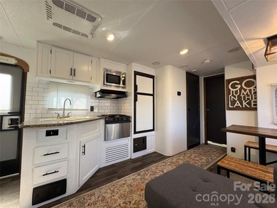 Welcome to easy lake living inside the gated community of Badin on Old North State Club at Uwharrie Point Golf community in North Carolina - for sale on GolfHomes.com, golf home, golf lot