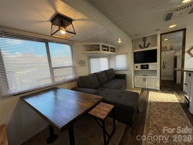 Welcome to easy lake living inside the gated community of Badin on Old North State Club at Uwharrie Point Golf community in North Carolina - for sale on GolfHomes.com, golf home, golf lot