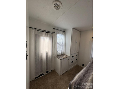 Welcome to easy lake living inside the gated community of Badin on Old North State Club at Uwharrie Point Golf community in North Carolina - for sale on GolfHomes.com, golf home, golf lot