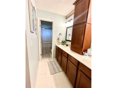 This upper-floor 2 bedroom, 2 bath condominium offers comfort on Palm Harbor Golf Club in Florida - for sale on GolfHomes.com, golf home, golf lot