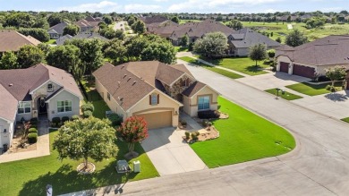This delightful 2-bedroom home with a study and 2.5 baths is on Wildhorse Golf Club of Robson Ranch in Texas - for sale on GolfHomes.com, golf home, golf lot