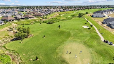 This delightful 2-bedroom home with a study and 2.5 baths is on Wildhorse Golf Club of Robson Ranch in Texas - for sale on GolfHomes.com, golf home, golf lot