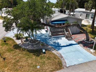 Located on a corner lot with ample room for guest parking, this on The Great Outdoors Golf and Country Club in Florida - for sale on GolfHomes.com, golf home, golf lot