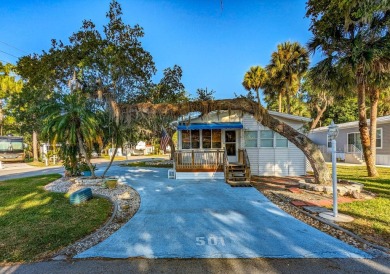 Located on a corner lot with ample room for guest parking, this on The Great Outdoors Golf and Country Club in Florida - for sale on GolfHomes.com, golf home, golf lot