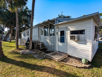 Located on a corner lot with ample room for guest parking, this on The Great Outdoors Golf and Country Club in Florida - for sale on GolfHomes.com, golf home, golf lot