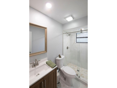 This beautiful 2/2/2 sitting on the 5th hole of the Golf Course on Martin Downs Country Club in Florida - for sale on GolfHomes.com, golf home, golf lot