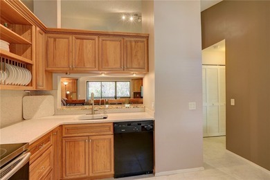 Beautifully furnished condo in gated community East of US 1 on Pelican Pointe 9 Hole Course in Florida - for sale on GolfHomes.com, golf home, golf lot