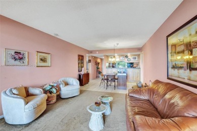 This 2 bedroom 2 bathroom 4th floor Whitehall Condo overlooking on Pine Island Ridge Country Club in Florida - for sale on GolfHomes.com, golf home, golf lot