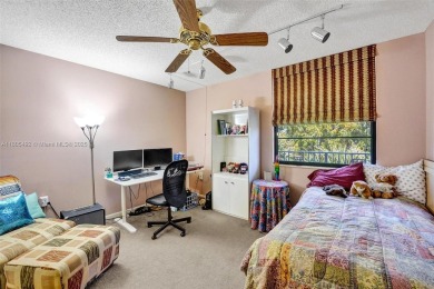 This 2 bedroom 2 bathroom 4th floor Whitehall Condo overlooking on Pine Island Ridge Country Club in Florida - for sale on GolfHomes.com, golf home, golf lot