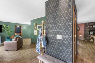 This 3-bedroom, 2-bath home has 1,676 sq. ft. of living space on Bella Vista Country Club and Golf Course in Arkansas - for sale on GolfHomes.com, golf home, golf lot