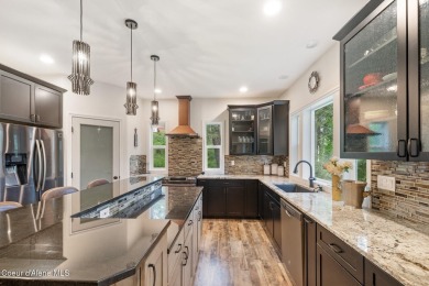 Discover lakefront living at its finest on Lake San Souci! This on Stoneridge Golf Club in Idaho - for sale on GolfHomes.com, golf home, golf lot