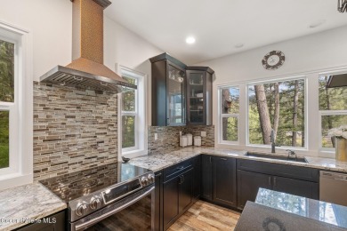Discover lakefront living at its finest on Lake San Souci! This on Stoneridge Golf Club in Idaho - for sale on GolfHomes.com, golf home, golf lot