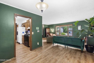 This 3-bedroom, 2-bath home has 1,676 sq. ft. of living space on Bella Vista Country Club and Golf Course in Arkansas - for sale on GolfHomes.com, golf home, golf lot