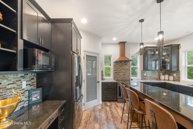 Discover lakefront living at its finest on Lake San Souci! This on Stoneridge Golf Club in Idaho - for sale on GolfHomes.com, golf home, golf lot