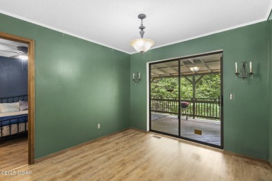 This 3-bedroom, 2-bath home has 1,676 sq. ft. of living space on Bella Vista Country Club and Golf Course in Arkansas - for sale on GolfHomes.com, golf home, golf lot