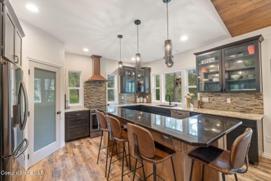 Discover lakefront living at its finest on Lake San Souci! This on Stoneridge Golf Club in Idaho - for sale on GolfHomes.com, golf home, golf lot