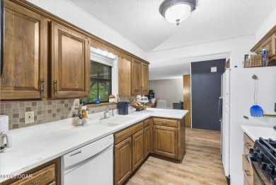 This 3-bedroom, 2-bath home has 1,676 sq. ft. of living space on Bella Vista Country Club and Golf Course in Arkansas - for sale on GolfHomes.com, golf home, golf lot
