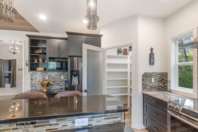 Discover lakefront living at its finest on Lake San Souci! This on Stoneridge Golf Club in Idaho - for sale on GolfHomes.com, golf home, golf lot