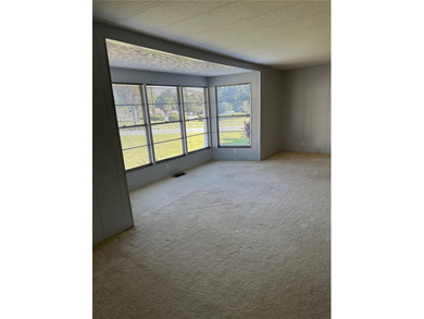 55+ Gated golf course community large 2 bedroom 2 bath home on a on Zellwood Station Country Club in Florida - for sale on GolfHomes.com, golf home, golf lot