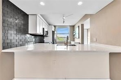 Lakefront Golf Course Condo. Move-in ready and beautifully on Pine Island Ridge Country Club in Florida - for sale on GolfHomes.com, golf home, golf lot