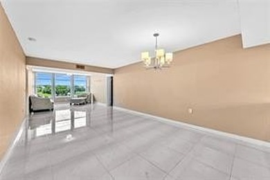 Lakefront Golf Course Condo. Move-in ready and beautifully on Pine Island Ridge Country Club in Florida - for sale on GolfHomes.com, golf home, golf lot