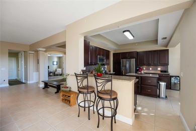 Discover refined Florida living at 23619 Awabuki Drive in the on Sarasota National Golf Club in Florida - for sale on GolfHomes.com, golf home, golf lot