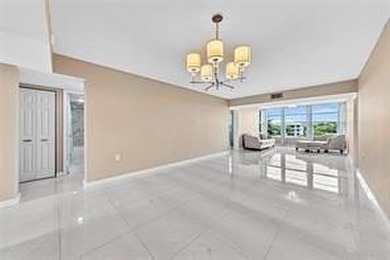 Lakefront Golf Course Condo. Move-in ready and beautifully on Pine Island Ridge Country Club in Florida - for sale on GolfHomes.com, golf home, golf lot