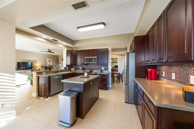 Discover refined Florida living at 23619 Awabuki Drive in the on Sarasota National Golf Club in Florida - for sale on GolfHomes.com, golf home, golf lot