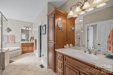 This five-bedroom, four-and-a-half-bathroom full brick home is on Emerald Lake Golf Club in North Carolina - for sale on GolfHomes.com, golf home, golf lot