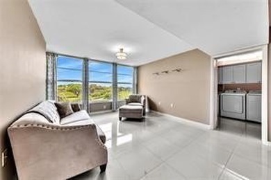 Lakefront Golf Course Condo. Move-in ready and beautifully on Pine Island Ridge Country Club in Florida - for sale on GolfHomes.com, golf home, golf lot