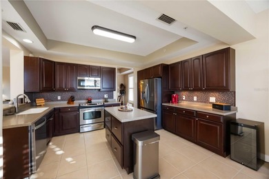 Discover refined Florida living at 23619 Awabuki Drive in the on Sarasota National Golf Club in Florida - for sale on GolfHomes.com, golf home, golf lot