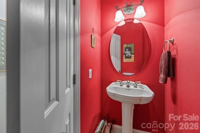 This five-bedroom, four-and-a-half-bathroom full brick home is on Emerald Lake Golf Club in North Carolina - for sale on GolfHomes.com, golf home, golf lot