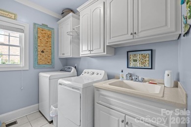 This five-bedroom, four-and-a-half-bathroom full brick home is on Emerald Lake Golf Club in North Carolina - for sale on GolfHomes.com, golf home, golf lot