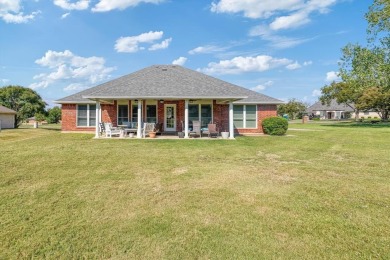 Discover this charming 3-bedroom, 2-bath home on a peaceful on Pecan Plantation Country Club in Texas - for sale on GolfHomes.com, golf home, golf lot