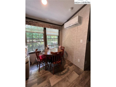 This cozy  2 bedroom, 2 bath mountain escape in Linviille Land on Land Harbor Golf Course in North Carolina - for sale on GolfHomes.com, golf home, golf lot