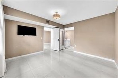 Lakefront Golf Course Condo. Move-in ready and beautifully on Pine Island Ridge Country Club in Florida - for sale on GolfHomes.com, golf home, golf lot