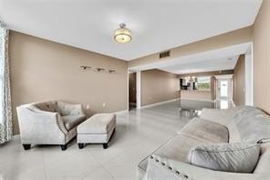 Lakefront Golf Course Condo. Move-in ready and beautifully on Pine Island Ridge Country Club in Florida - for sale on GolfHomes.com, golf home, golf lot