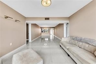 Lakefront Golf Course Condo. Move-in ready and beautifully on Pine Island Ridge Country Club in Florida - for sale on GolfHomes.com, golf home, golf lot