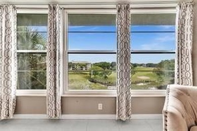 Lakefront Golf Course Condo. Move-in ready and beautifully on Pine Island Ridge Country Club in Florida - for sale on GolfHomes.com, golf home, golf lot