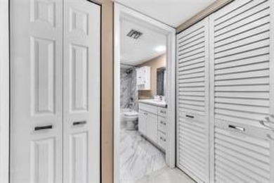 Lakefront Golf Course Condo. Move-in ready and beautifully on Pine Island Ridge Country Club in Florida - for sale on GolfHomes.com, golf home, golf lot