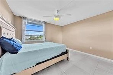 Lakefront Golf Course Condo. Move-in ready and beautifully on Pine Island Ridge Country Club in Florida - for sale on GolfHomes.com, golf home, golf lot