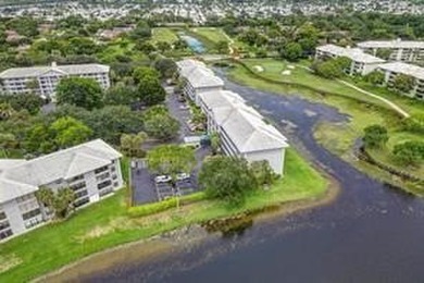 Lakefront Golf Course Condo. Move-in ready and beautifully on Pine Island Ridge Country Club in Florida - for sale on GolfHomes.com, golf home, golf lot